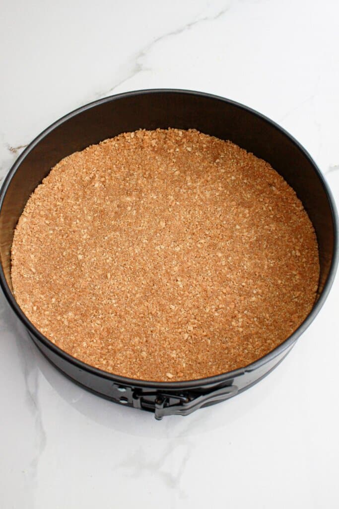 graham cracker crust pressed into a springform pan.