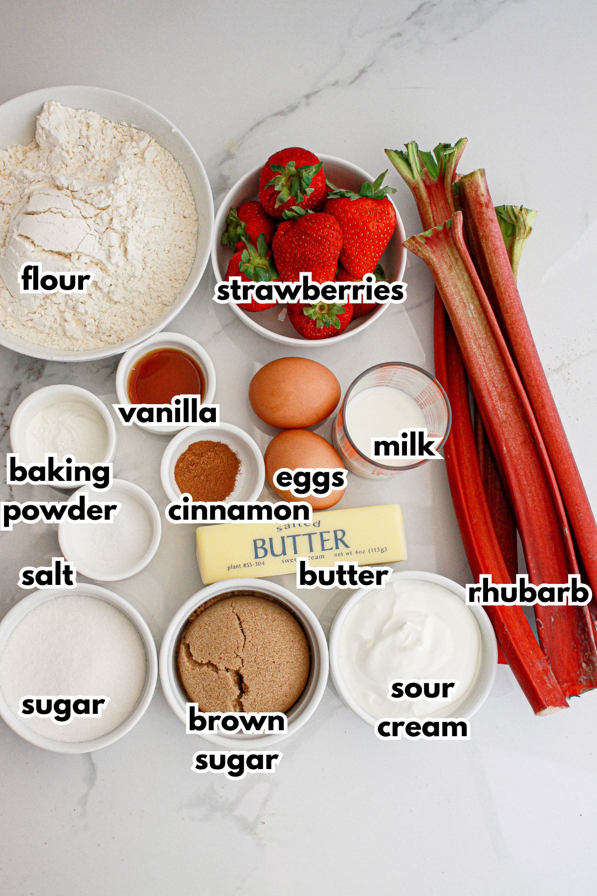 bowls of ingredients neeeded to make rhubarb strawberry bundt cake on a counter.