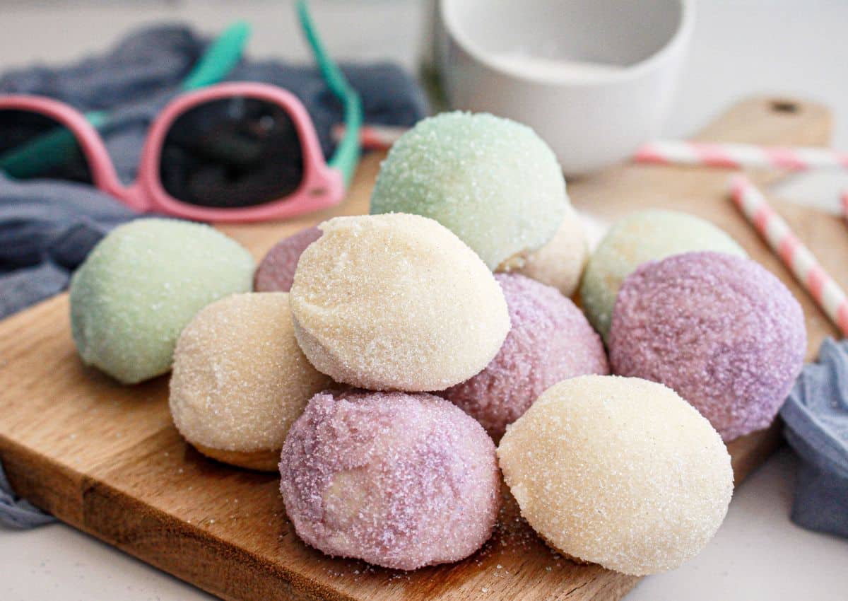 snow cone truffles on a cutting board ready to serve.