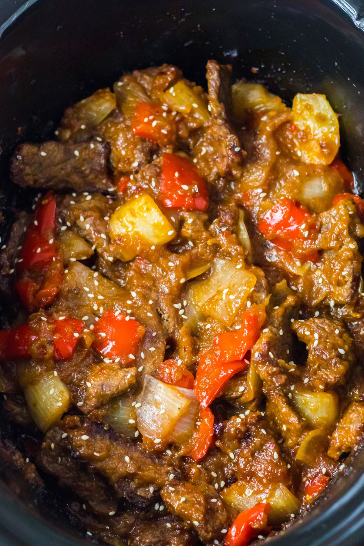 slow cooker full of cooked beijing beef.
