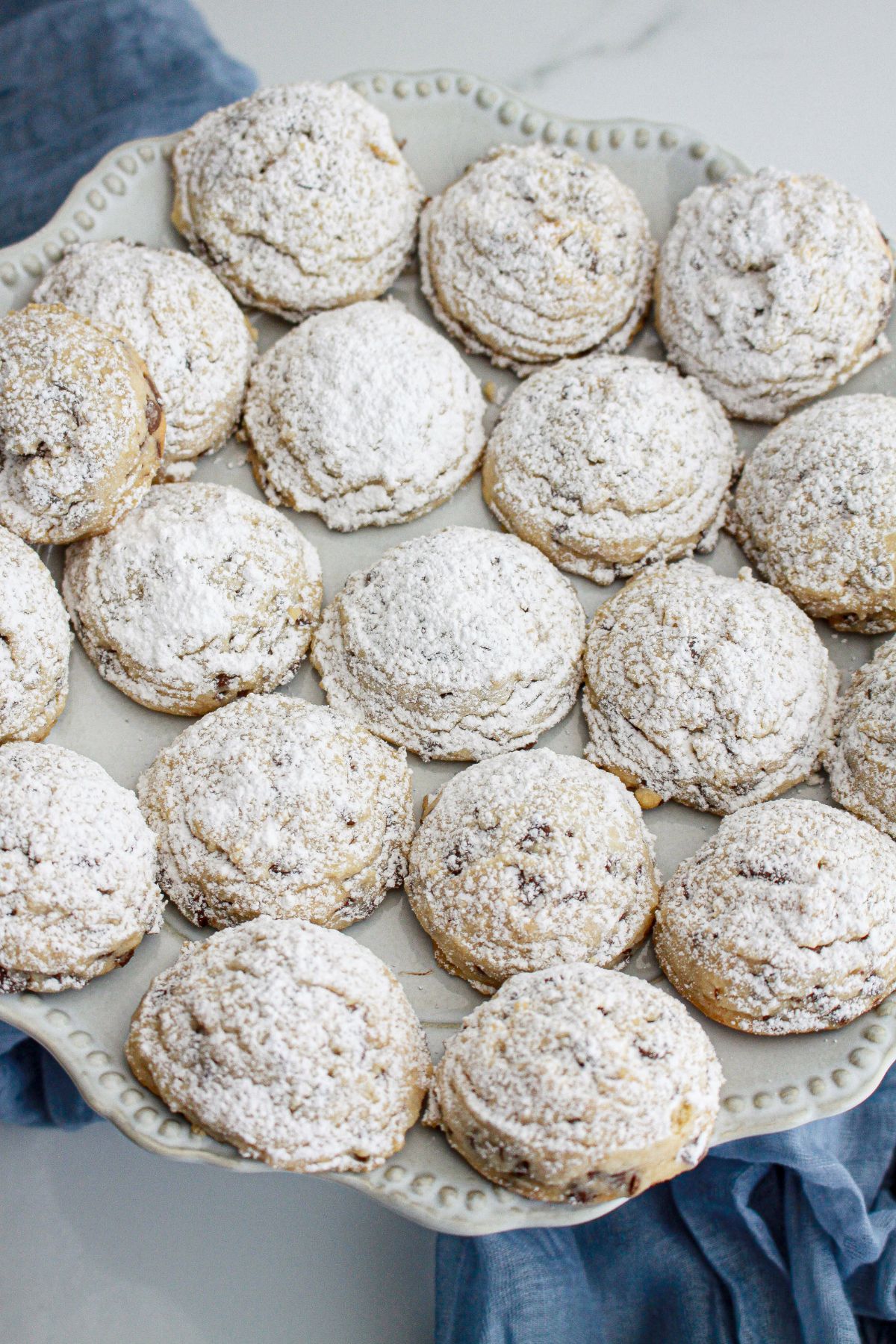 chocolate chip snowball cookies on a serving platter.