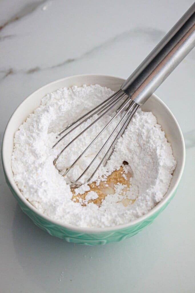 glaze being mixed in a small bowl.
