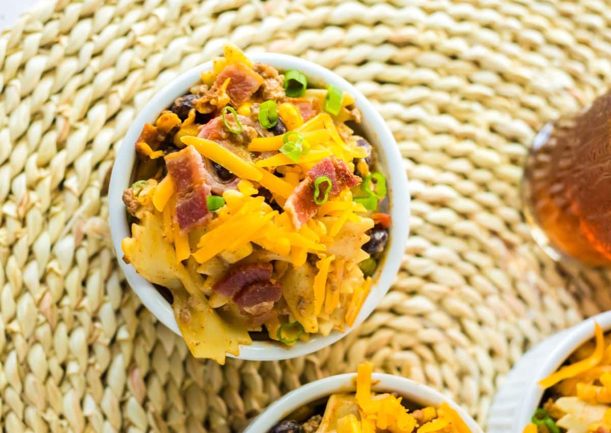 bowl full of cowboy pasta salad on a placemat.