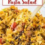 wooden spoon full of cowboy pasta salad.