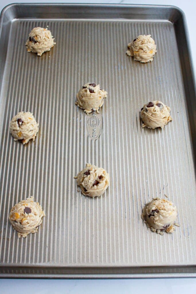 dough balls on a baking sheet ready for the oven,
