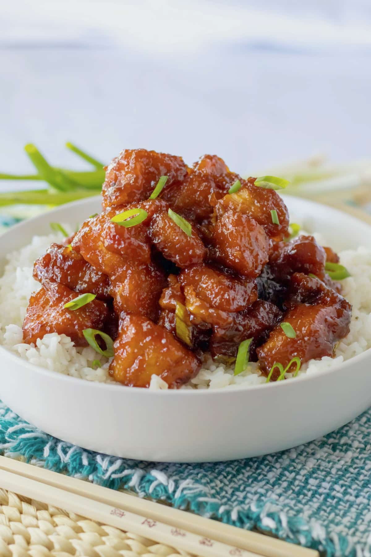 bowl of rice and topped with firecracker chicken.