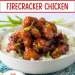 bowl of rice and topped with firecracker chicken.