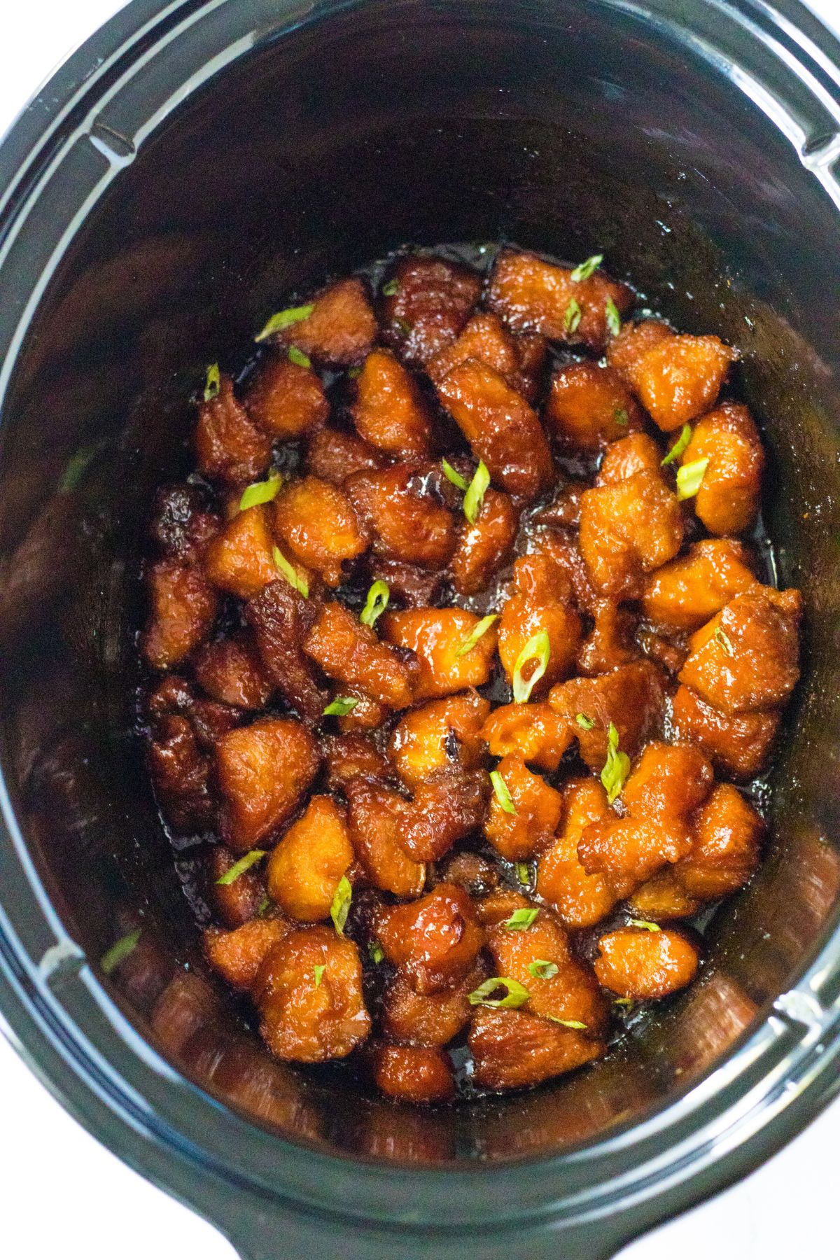 cooked firecracker chicken in a slow cooker.