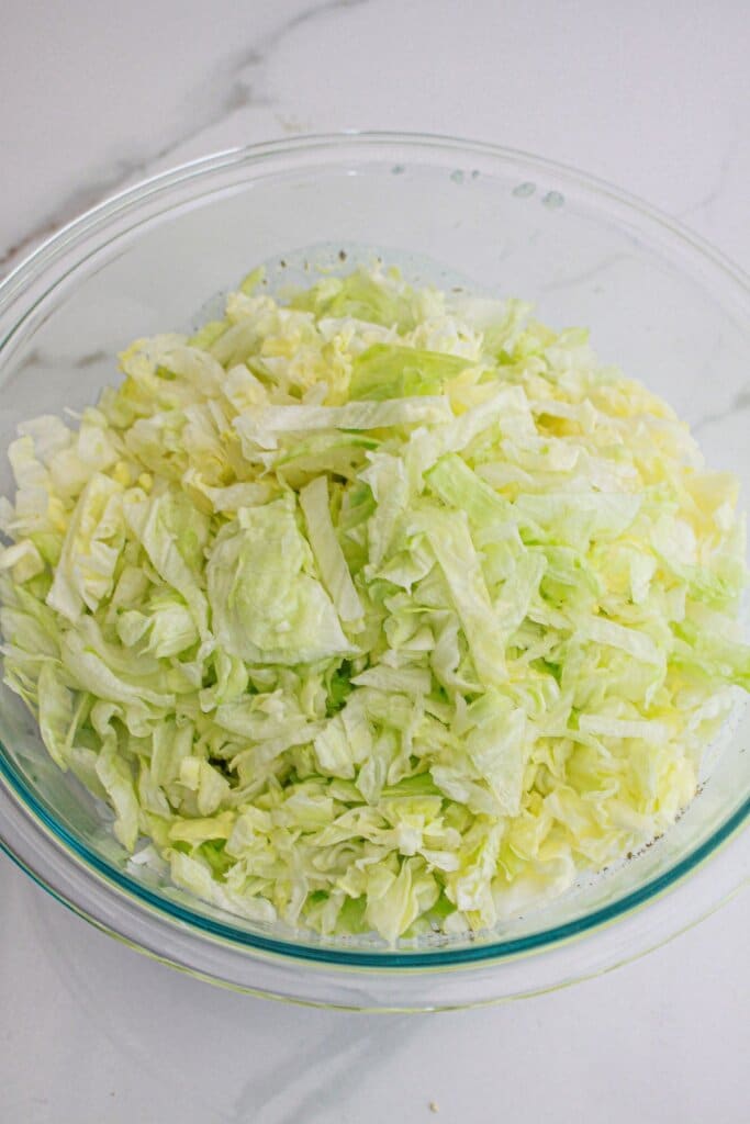lettuce in a large glass bowl.