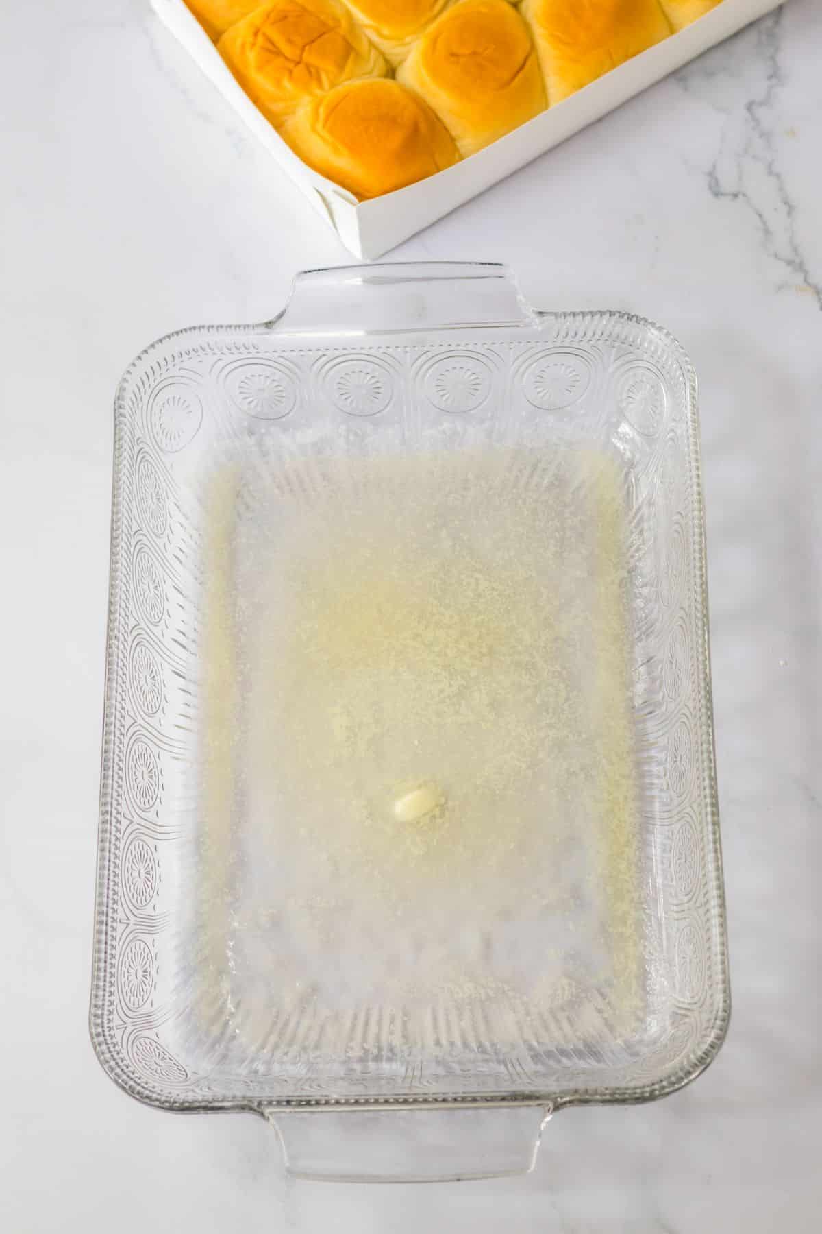 butter meled in a baking dish.