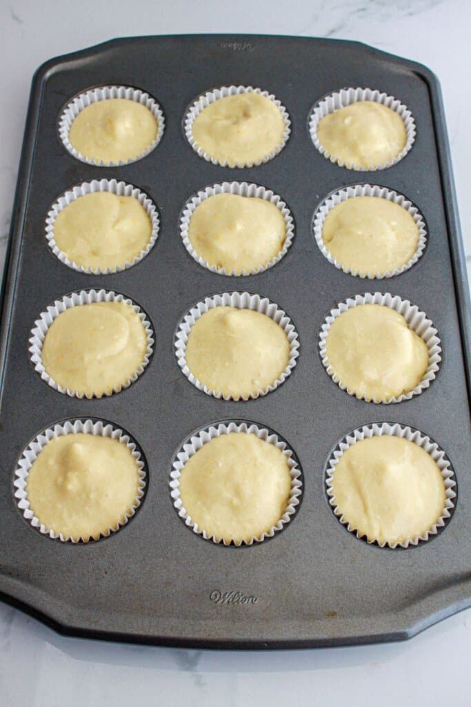 cupcake batter in a muffin pan ready for the oven.