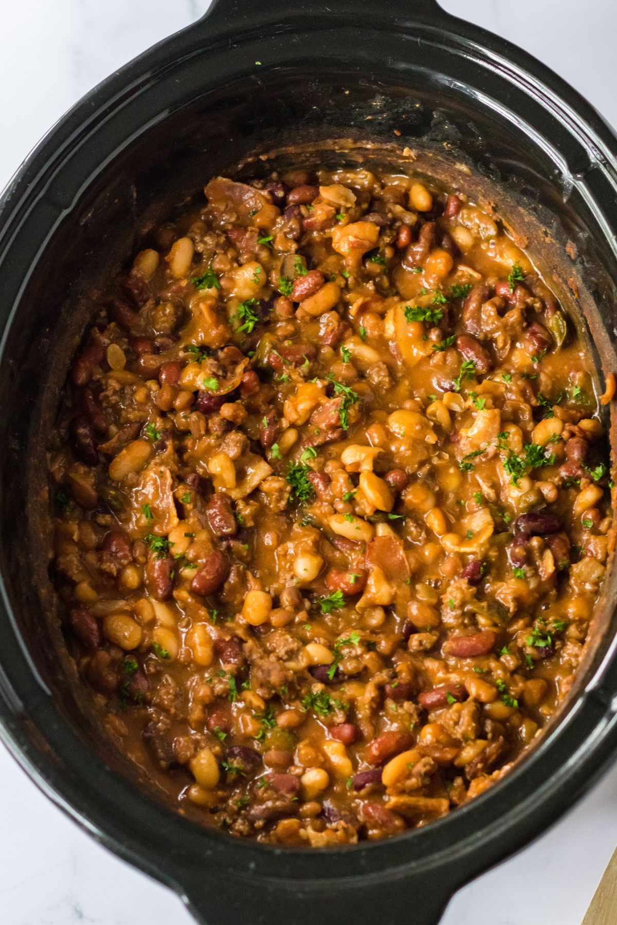 cowboy beans cooked in a slow cooker.