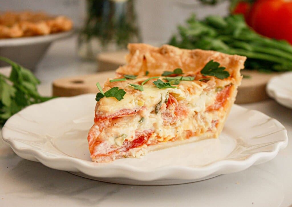 slice of southern tomato pie on a small plate.