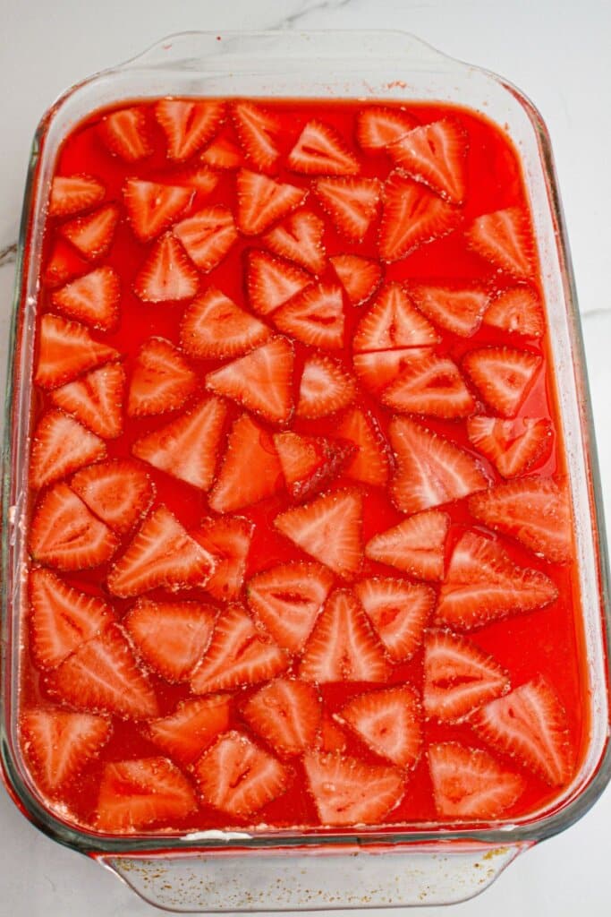 assembled strawberry pretzel salad in a glass baking dish.