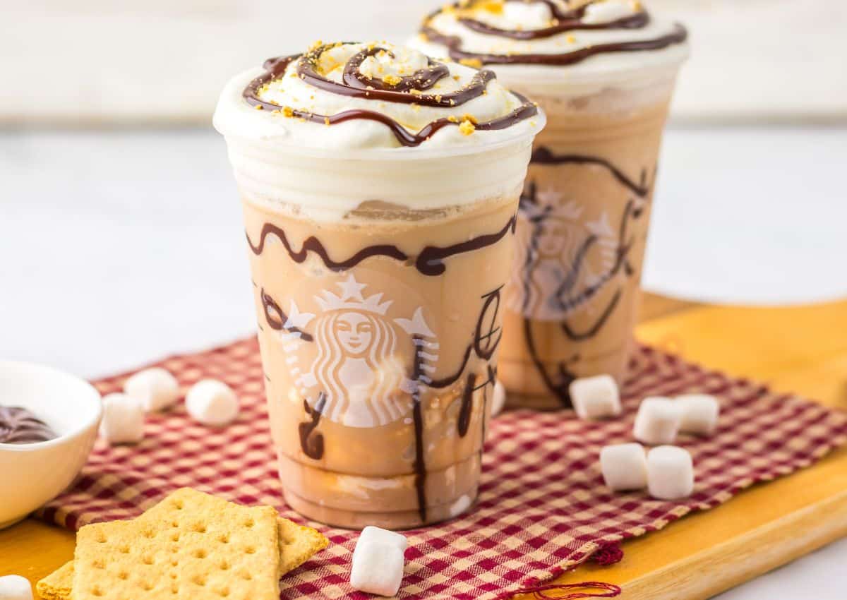 Two smores frappuccinos on a counter.
