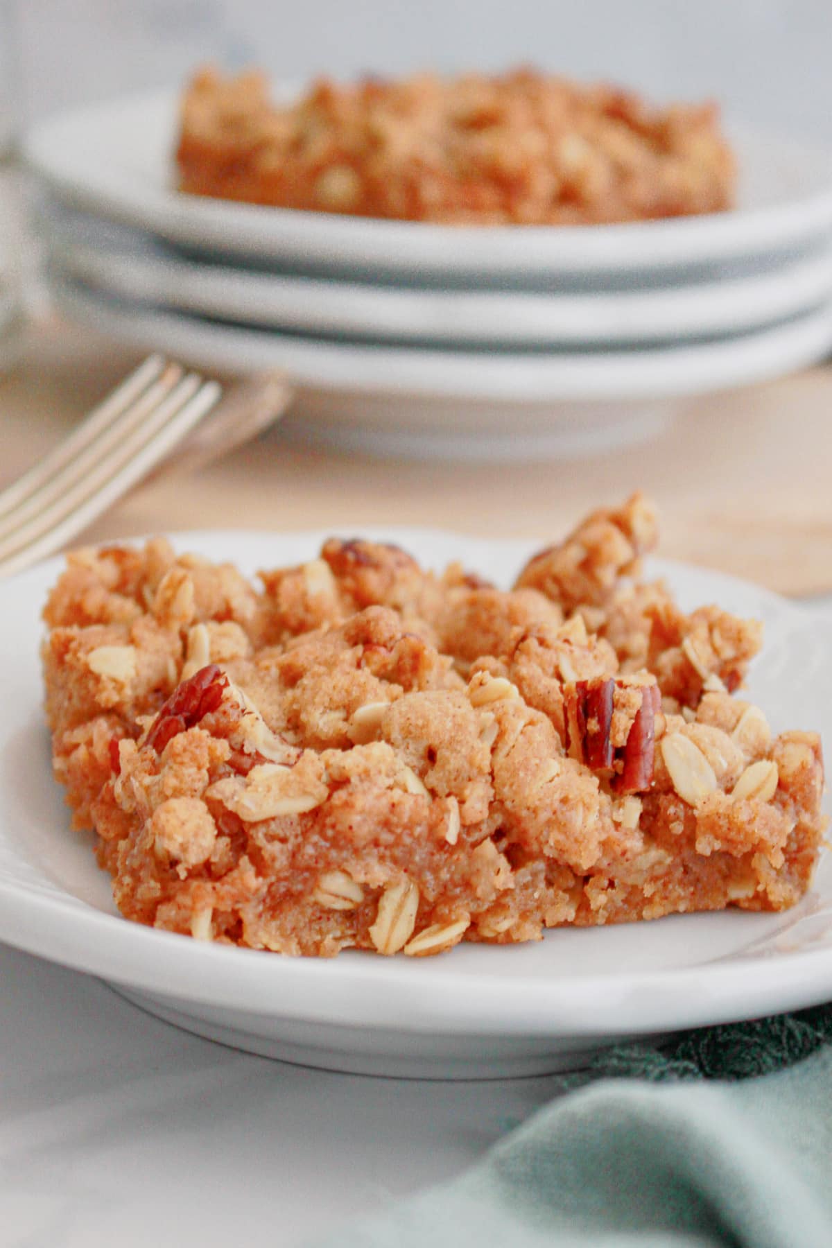 slice of applesauce oat bars on a small plate.