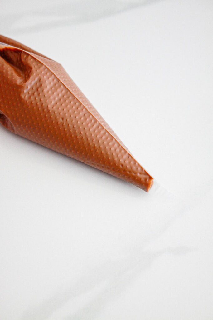Melted chocolate in a piping bag.