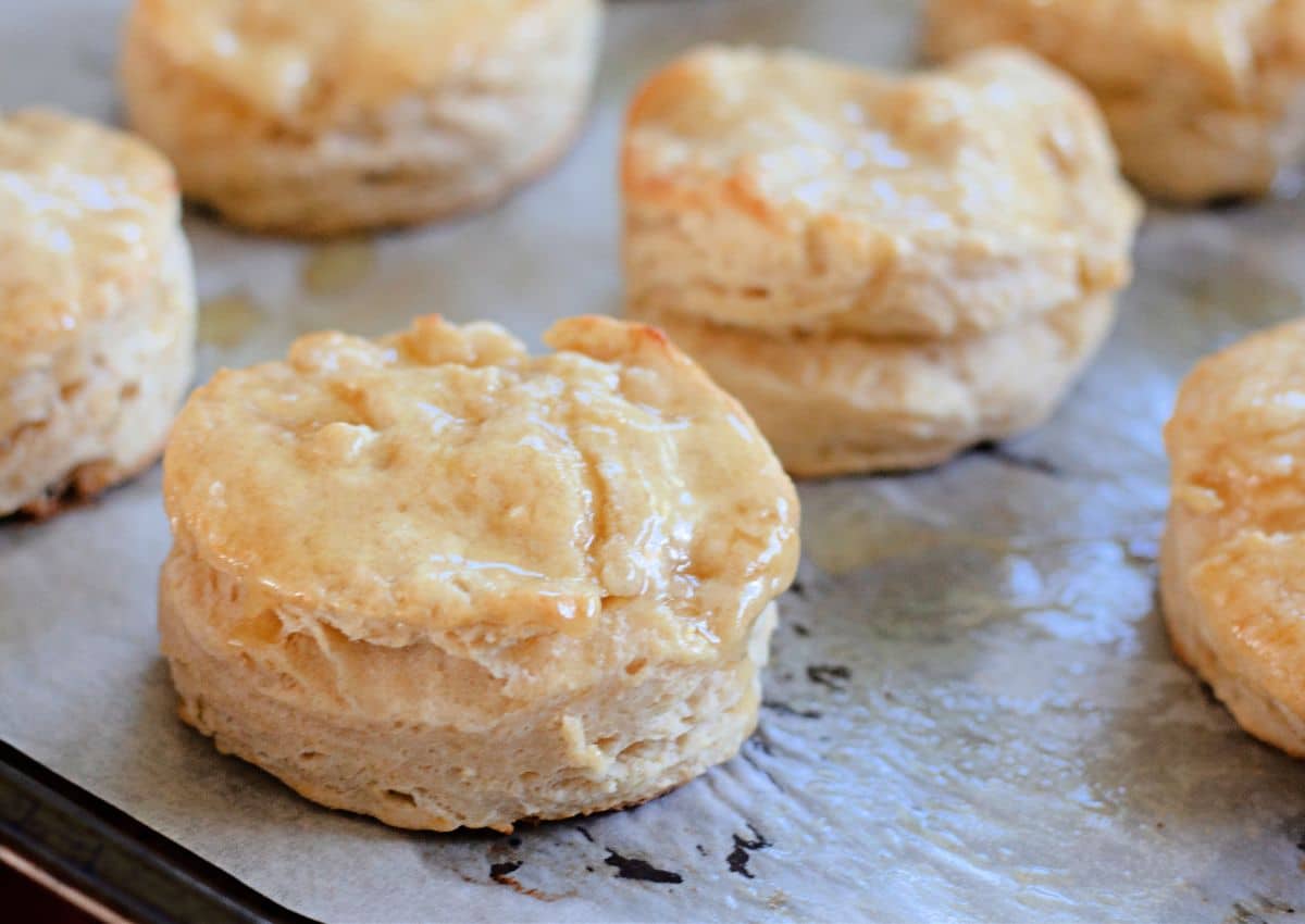 honey butter biscuits on a baking sheet.