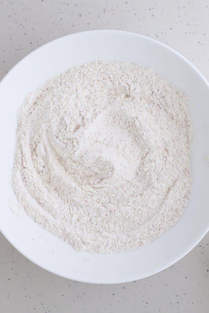 Mixture of flour and easonings on a plate.