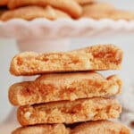 two pumpkin snickerdoodles broken on half and stacked on top of each other.