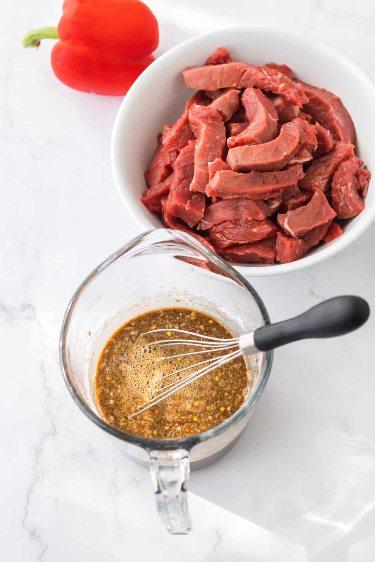 Marinade being mixed in a small mixing bowl.