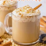 Slow cooker pumpkin spice latte in a glass mug topped with a cinnamon stick.