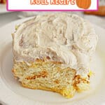 Pumpkin cinnamon roll on a small plate ready to serve.
