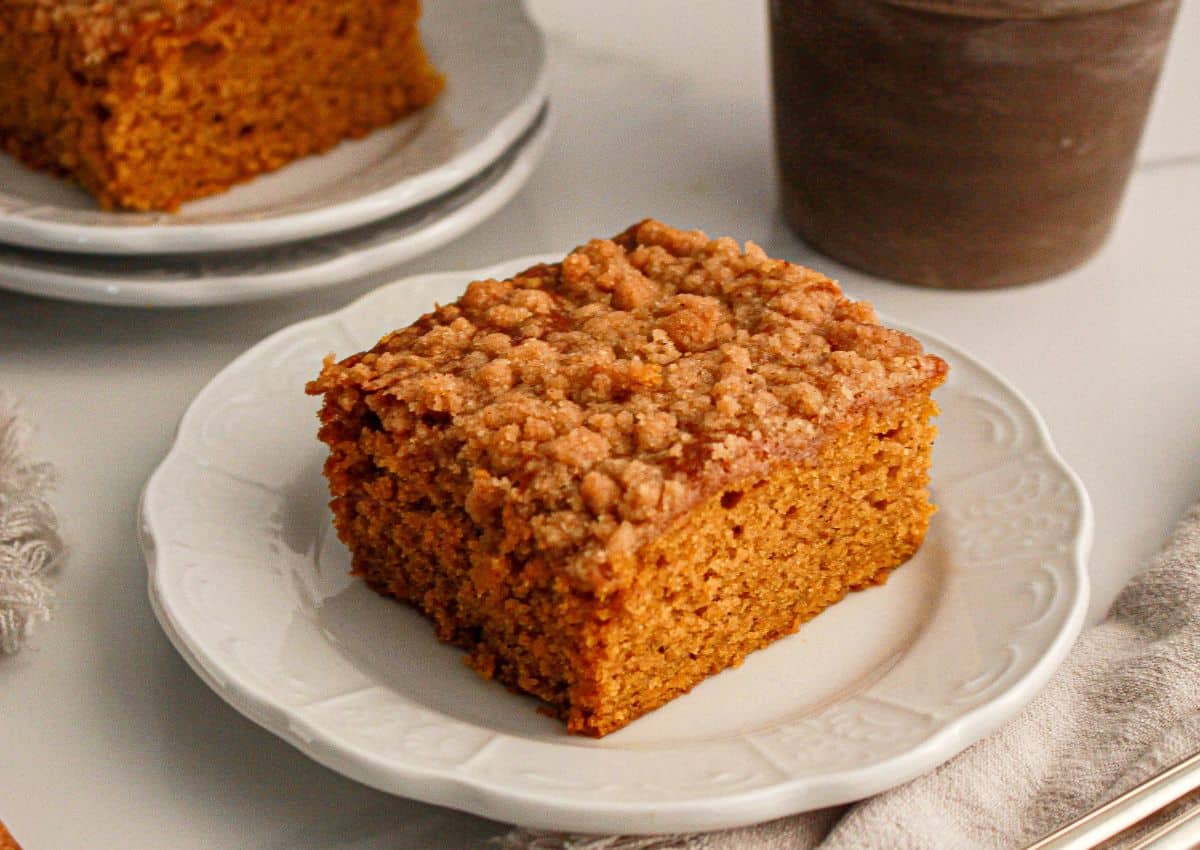Slice of pumpkin coffee cake on a small plate.