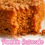 Slice of pumpkin coffee cake on a plate with a bite missing.