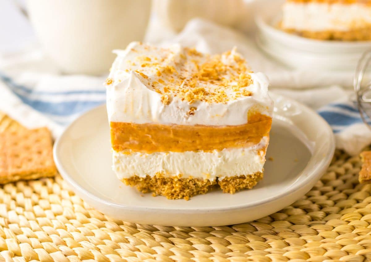 Slice of pumpkin lush dessert on a plate.