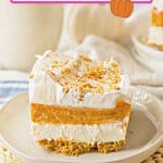 Slice of pumpkin lush dessert on a plate.