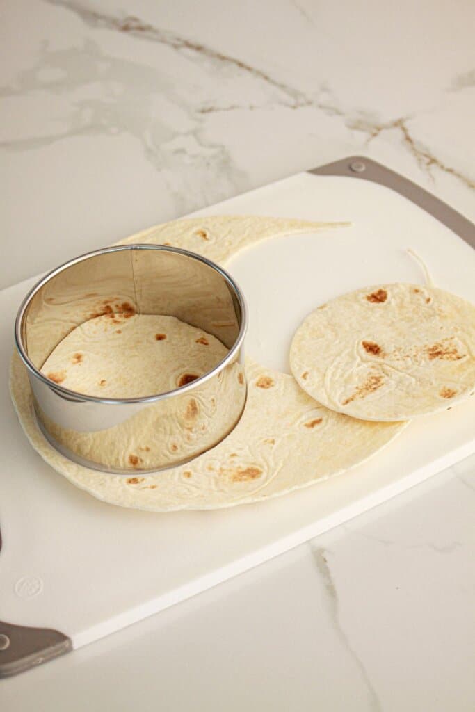 Tortillas being cut.