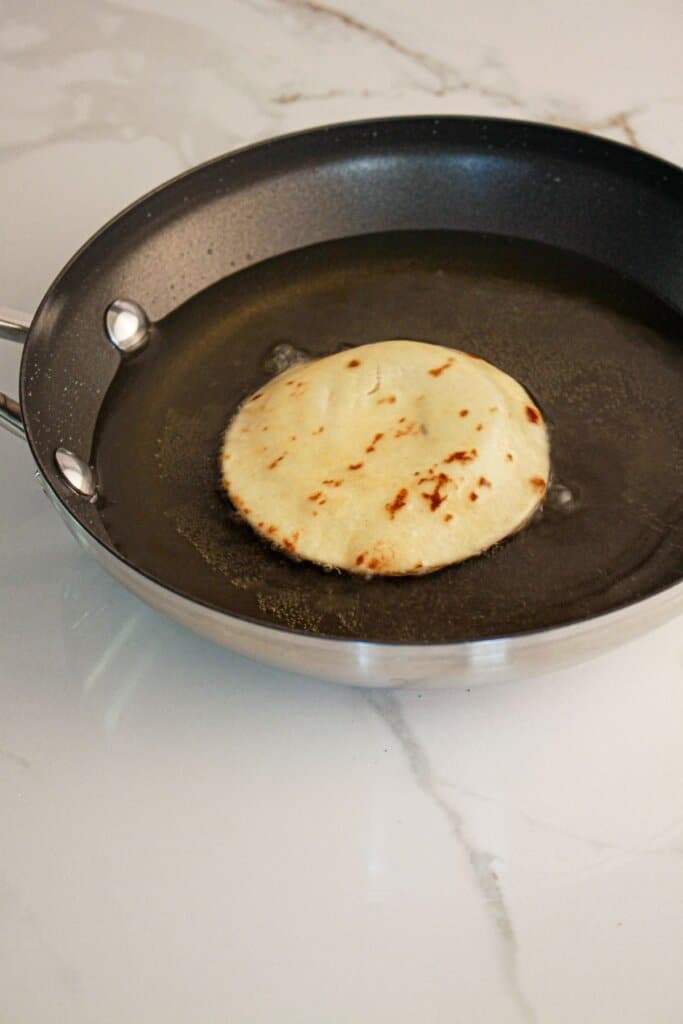 Tortilla being fried.