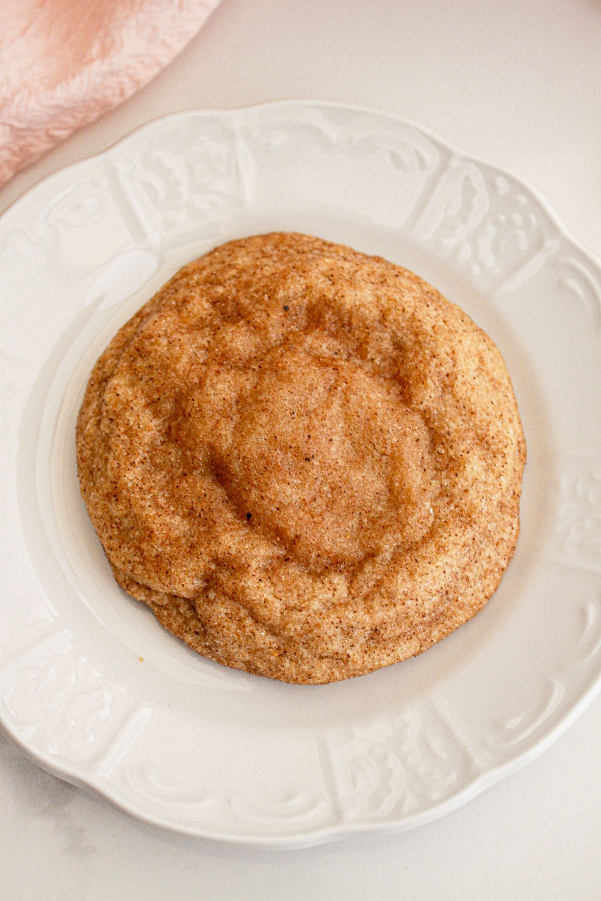 Pumpkin spice cheesecake cookie on a small plate.