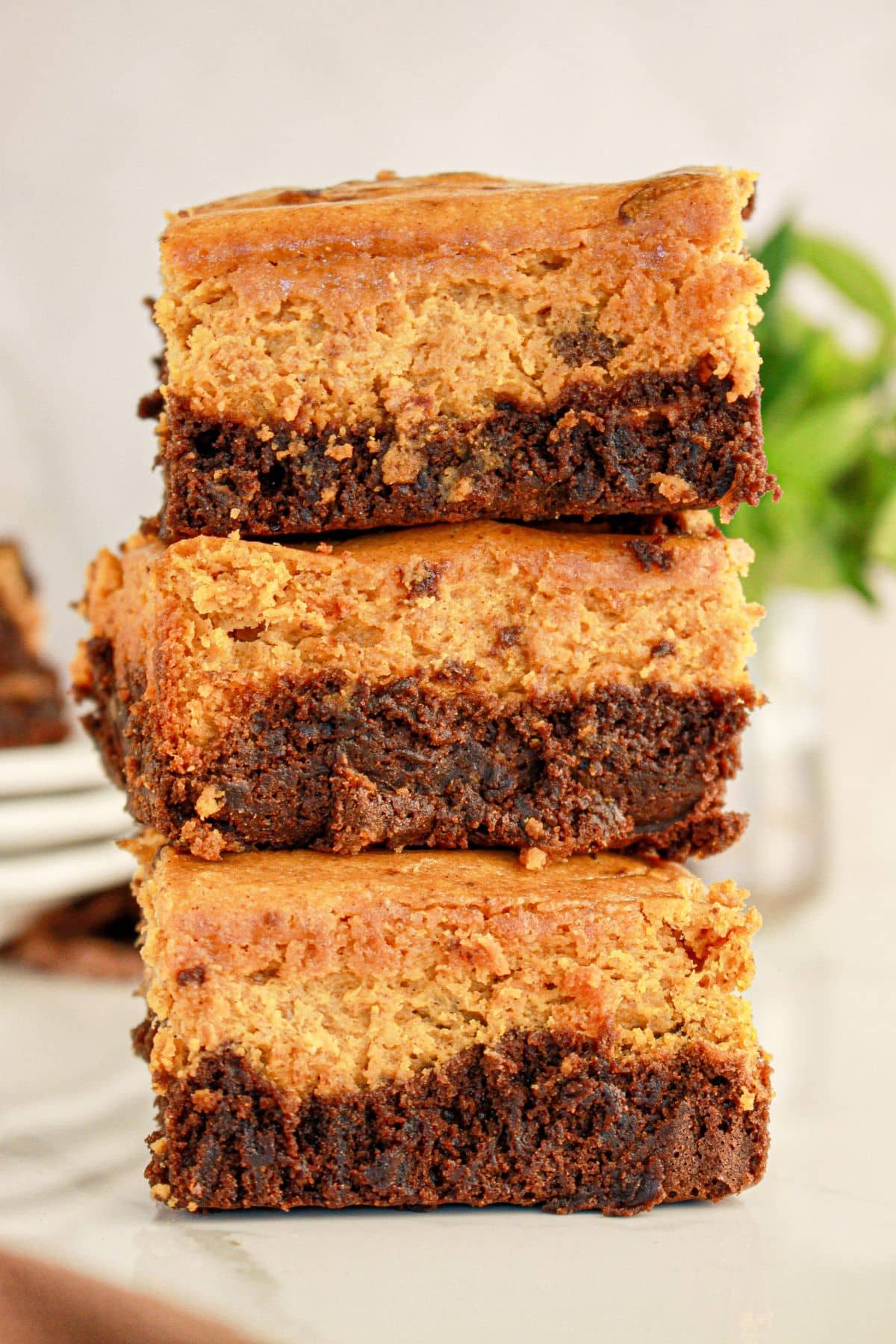 Three pumpkin brownies stacked.