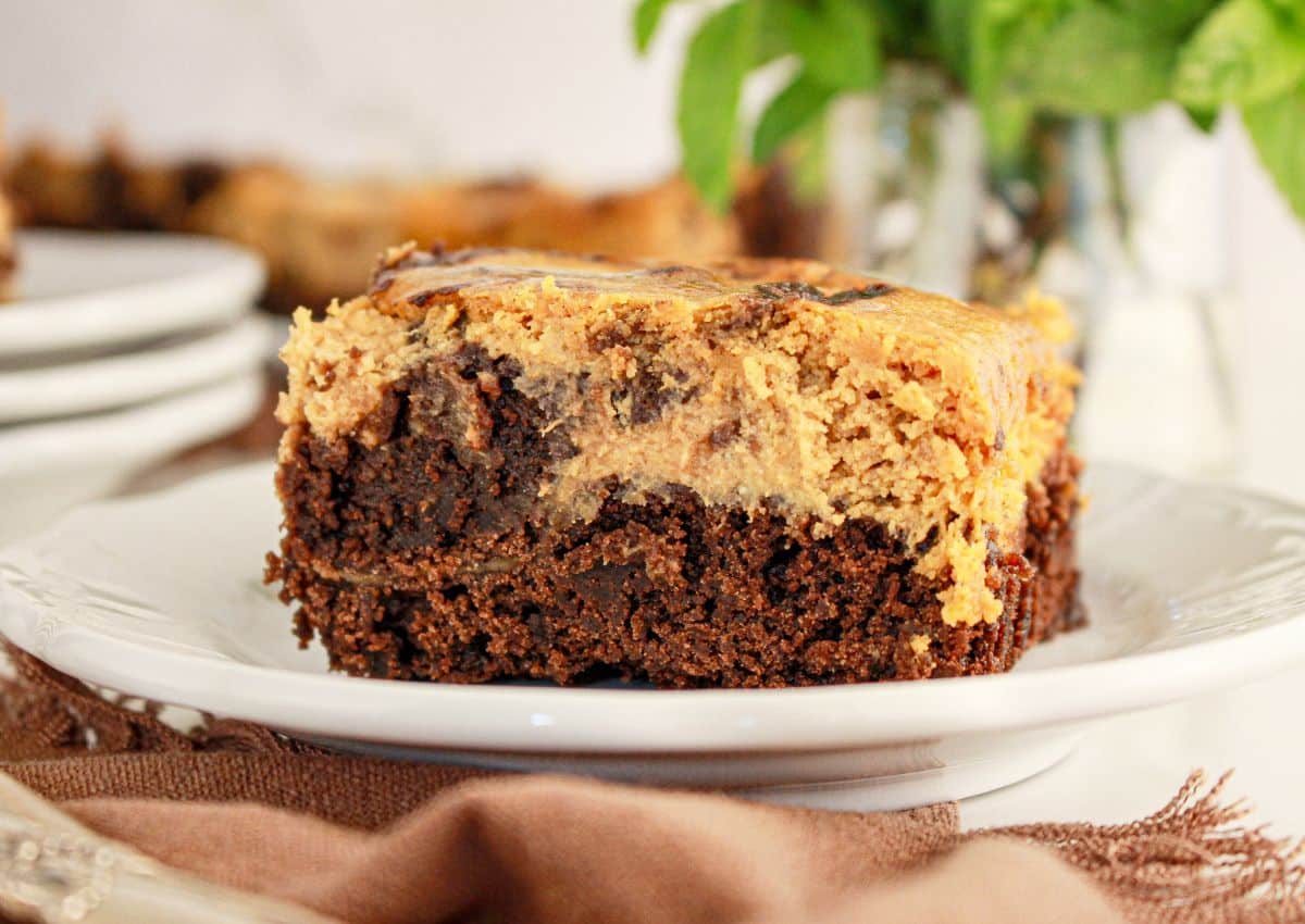 Pumpkin brownie on small plate.