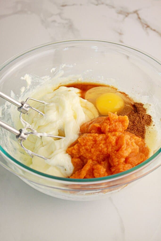 Wet ingredients being mixed in bowl.