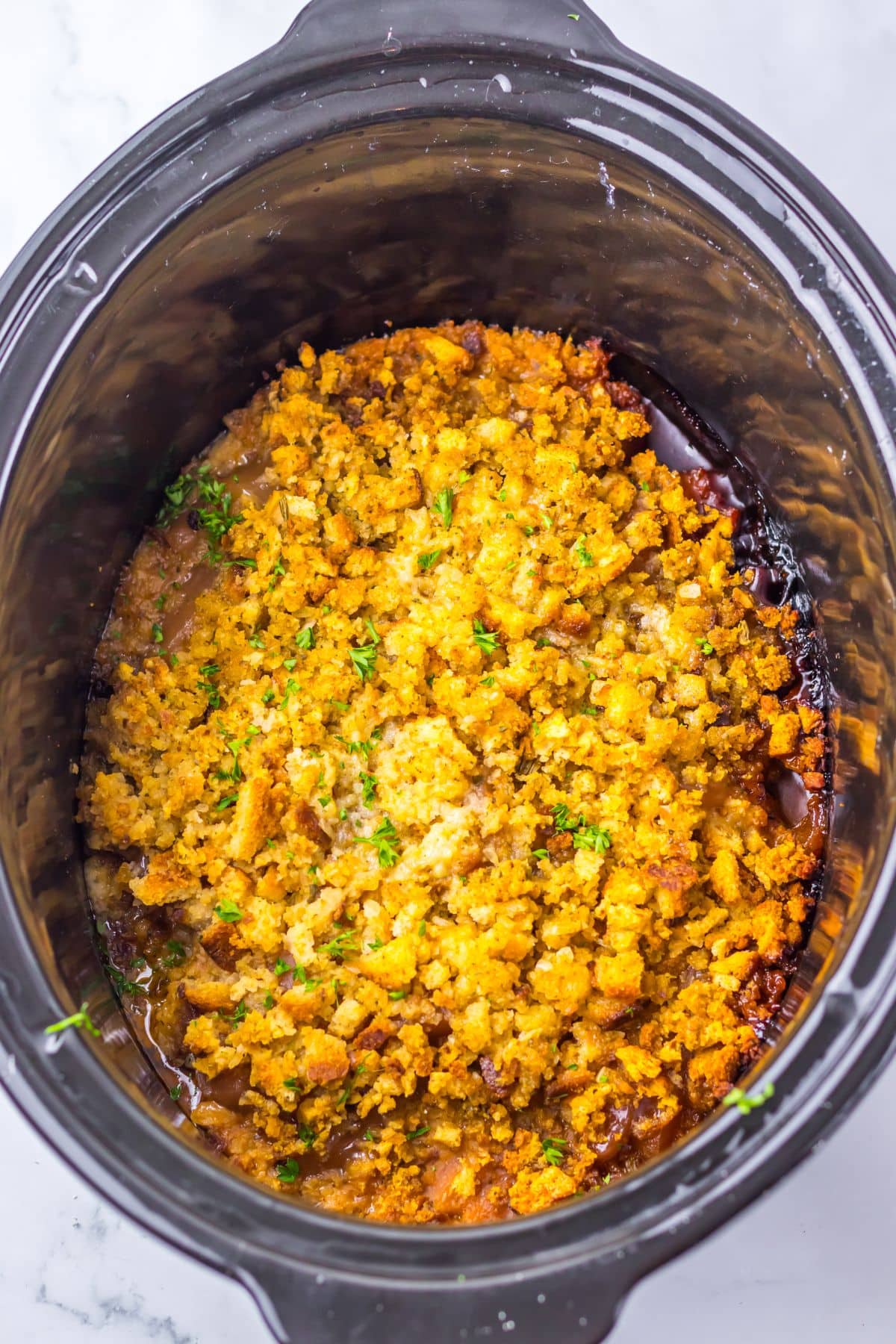 Slow cooker full of food.