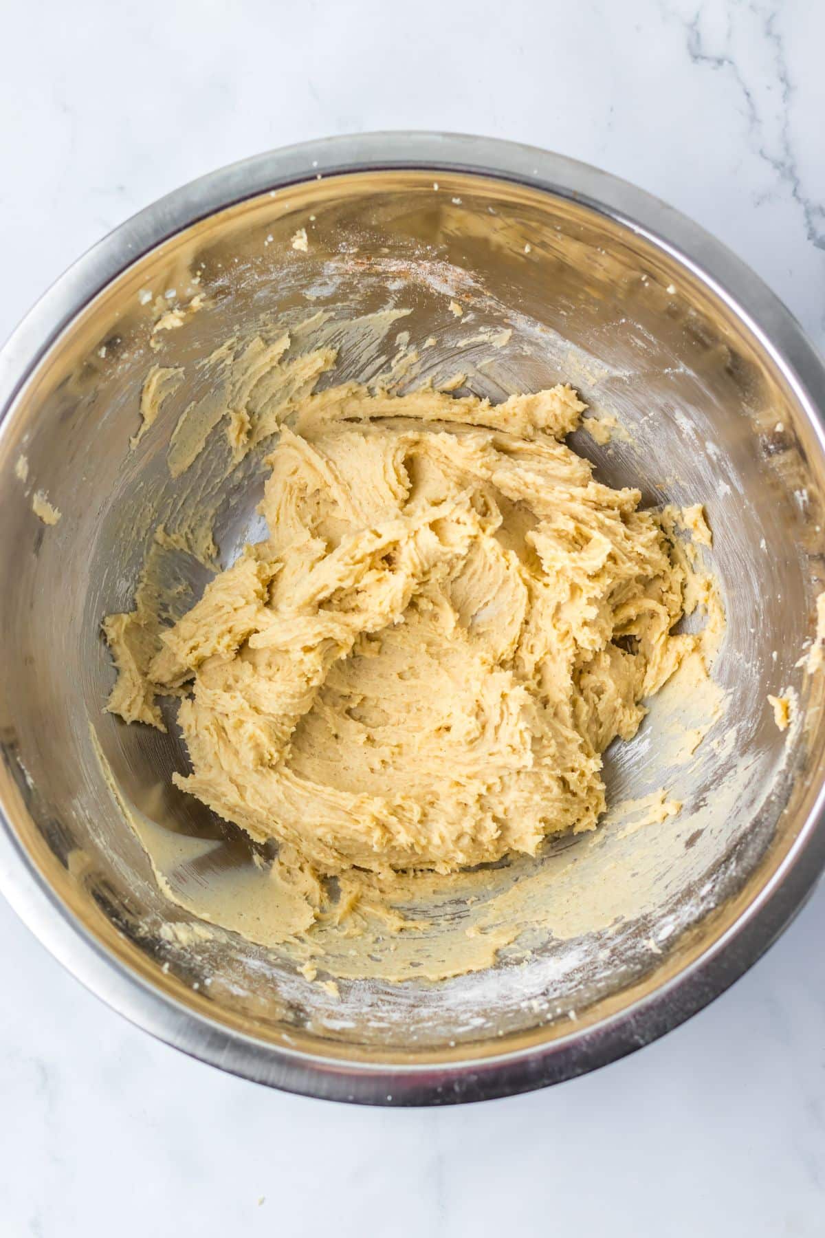 Cookie dough in mixing bowl.