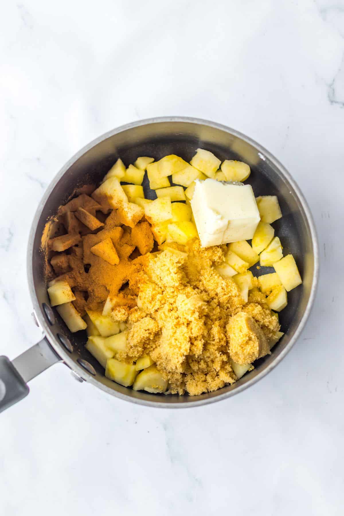 Apple ingredients in saucepan.