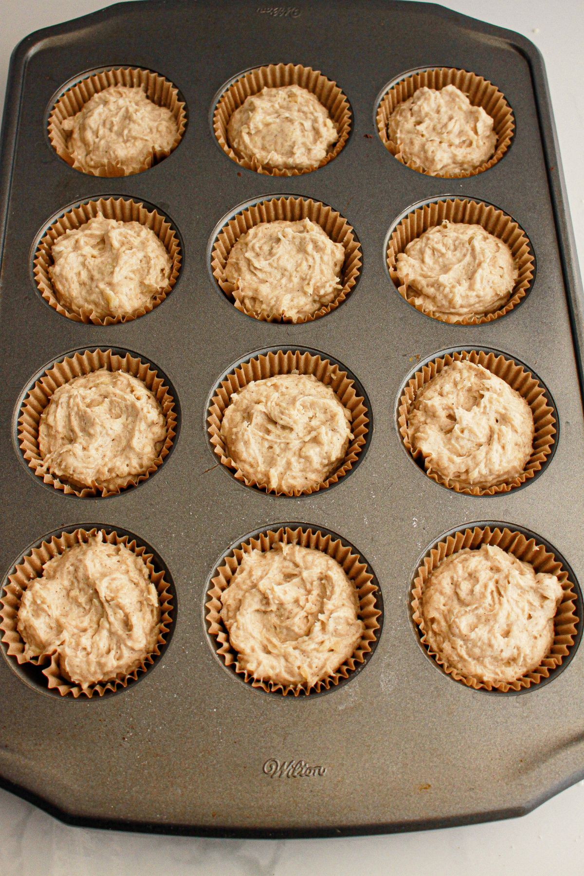 Batter in a cupcake pan.