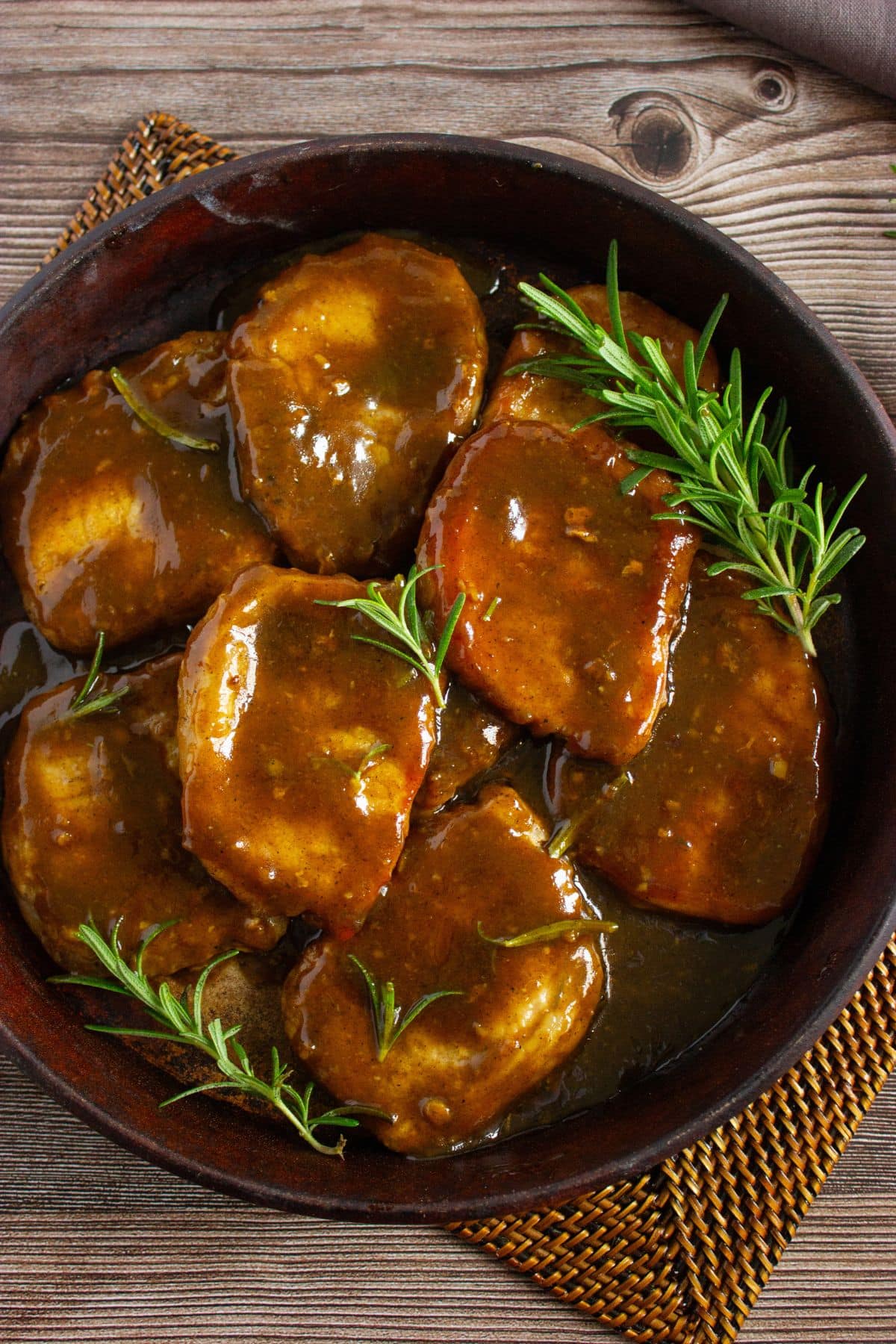 Pork chops in a cast iron skillet.