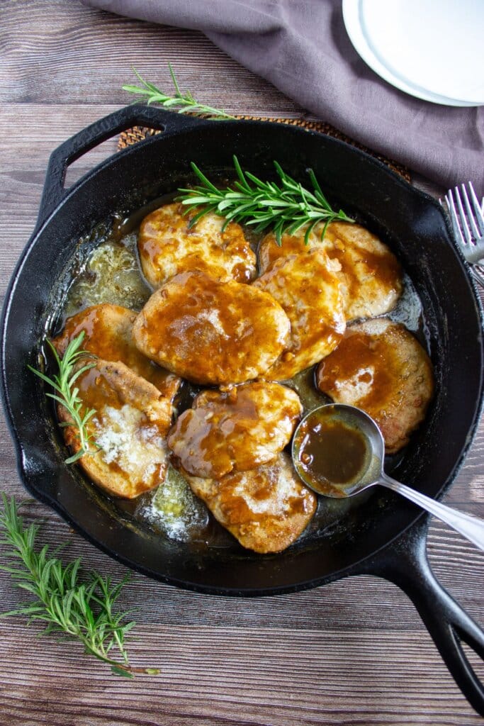 pork chop in a cast iron skillet.