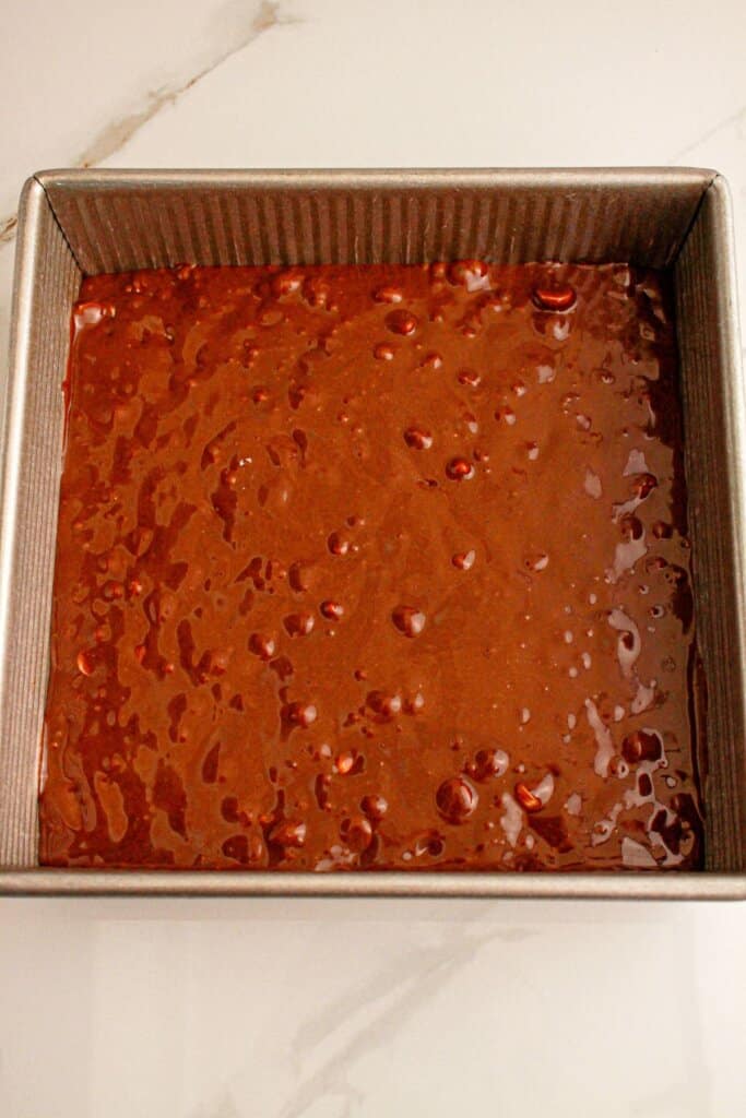 Brownie batter in a baking dish.