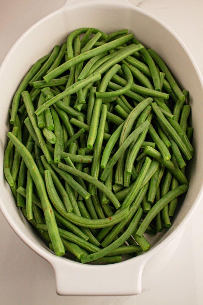 Fresh green beans in a baking dish.
