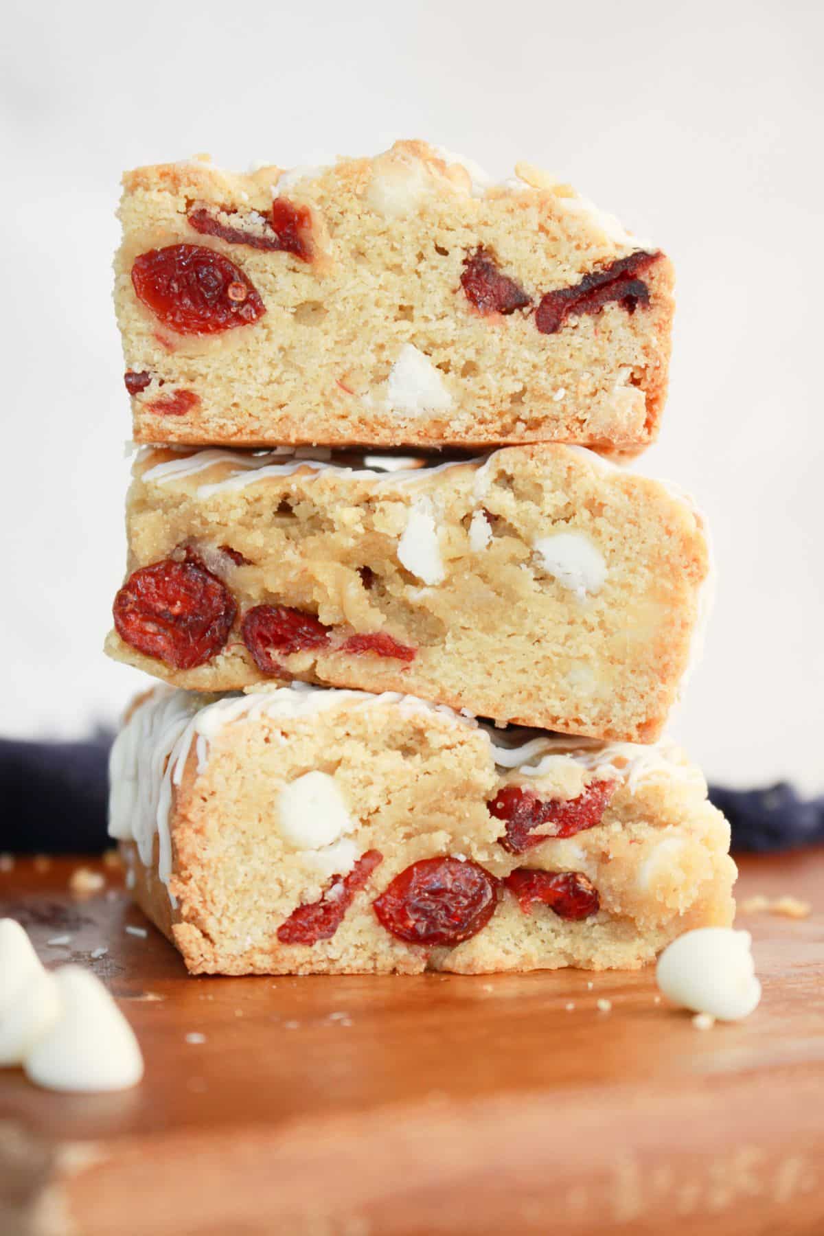 Three cranberry bars stacked on top of each other.