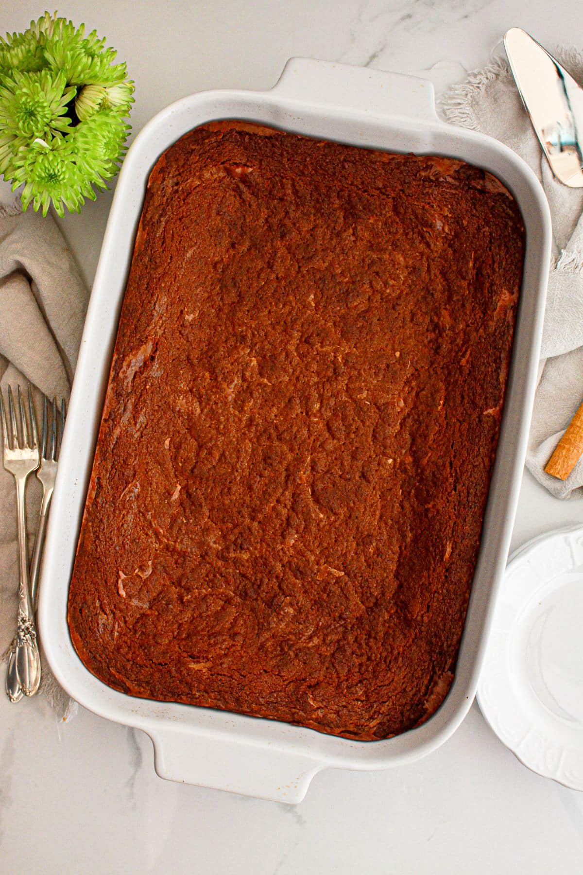 Gingerbread cheesecake bars in the baking dish.