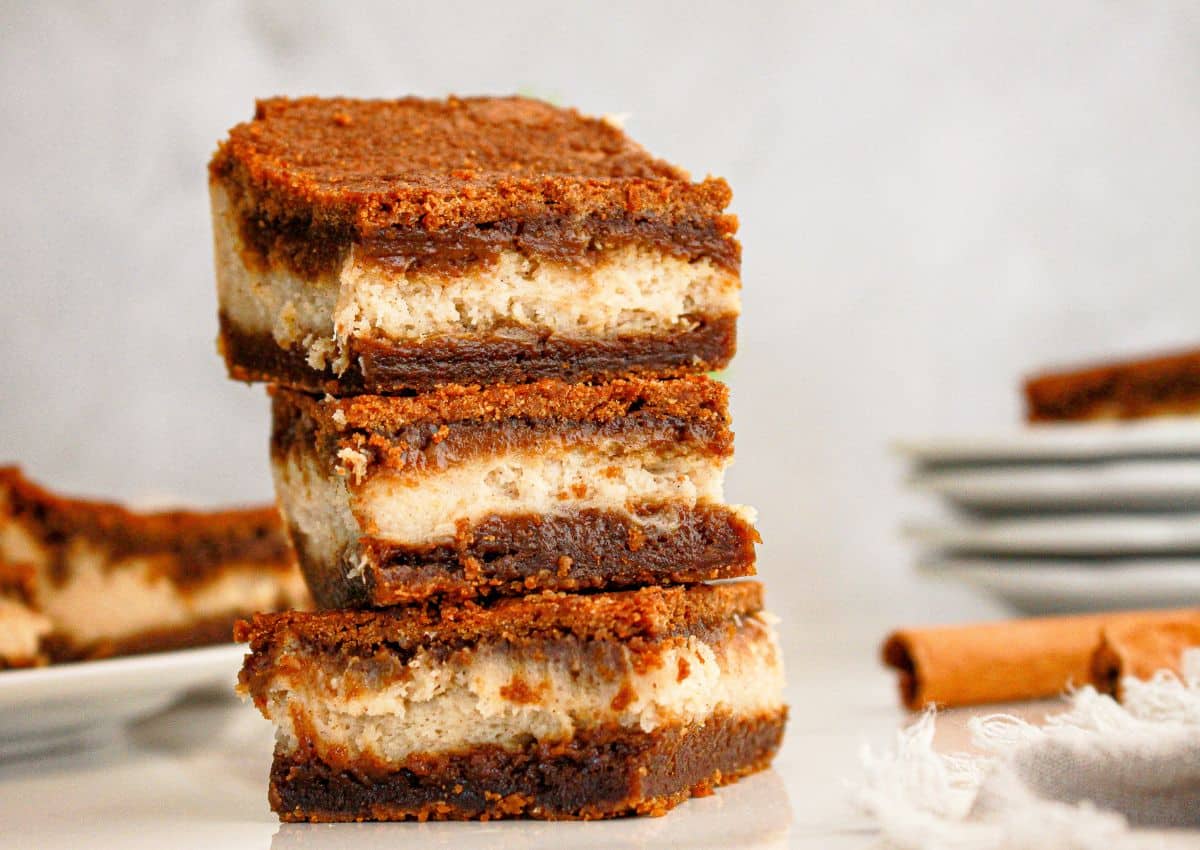 Gingerbread cheesecake bars on counter.
