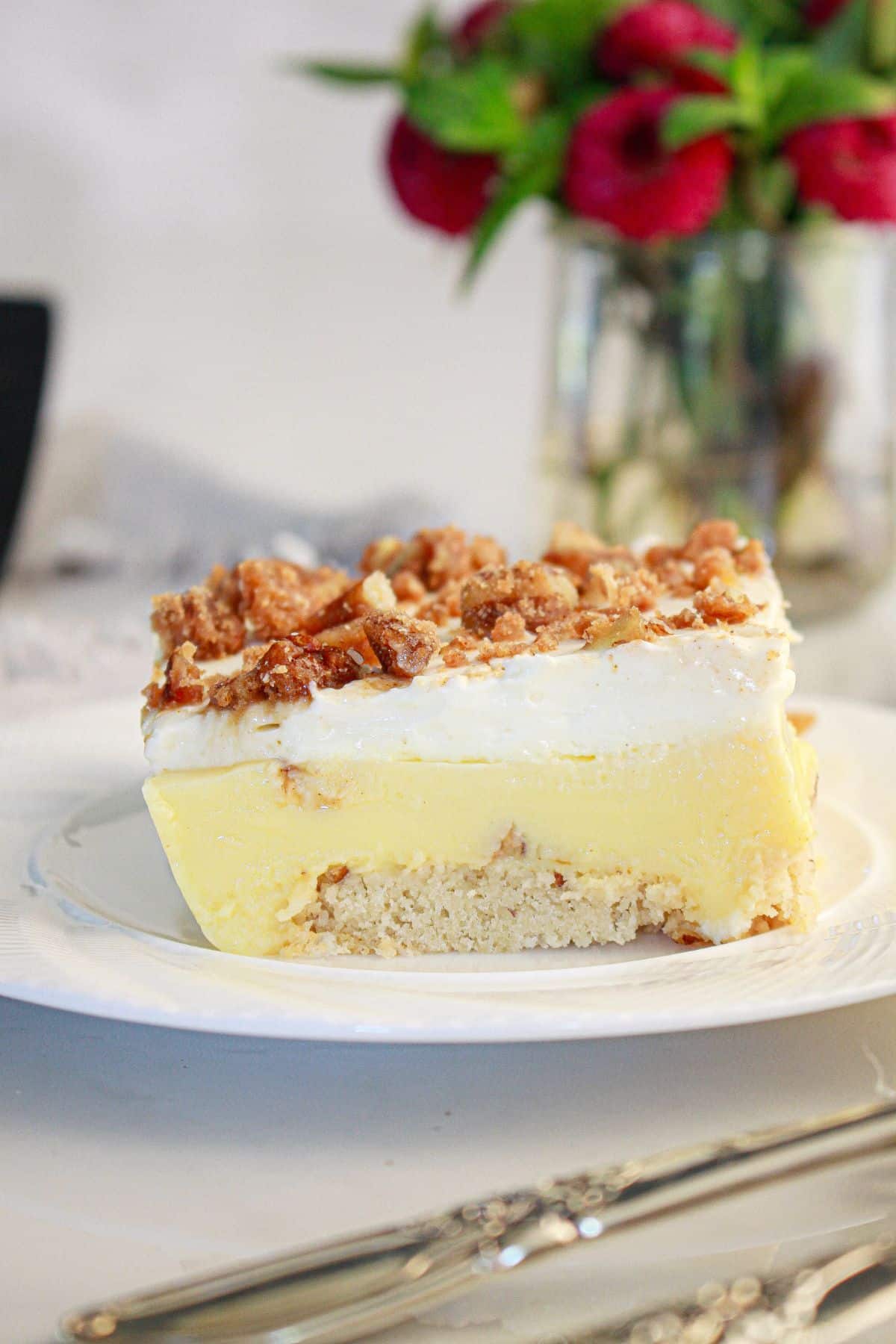 Slice of pecan pie lasagna on a plate.