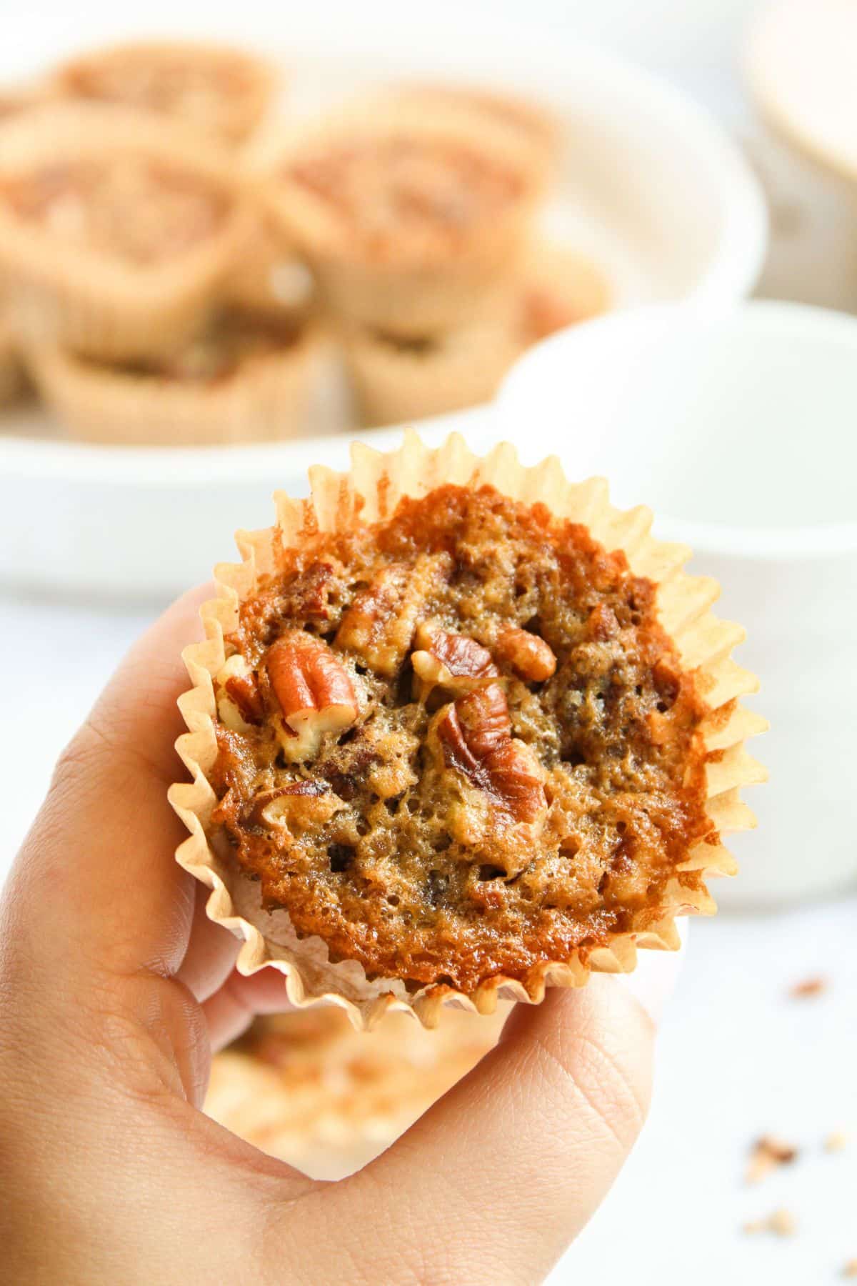 Muffin held in a woman hand.